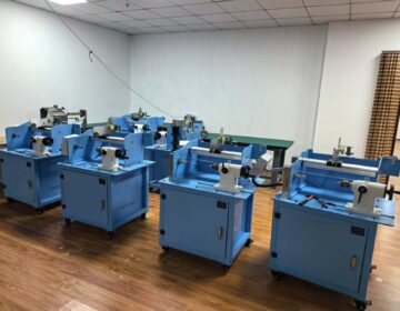 Blue wire winding machines arranged in the production room