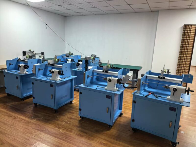 Blue wire winding machines arranged in the production room