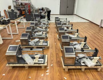 Rows of touch screen automatic winding machines on the factory floor