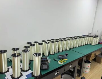 Fiber spools and winding equipment on an assembly bench