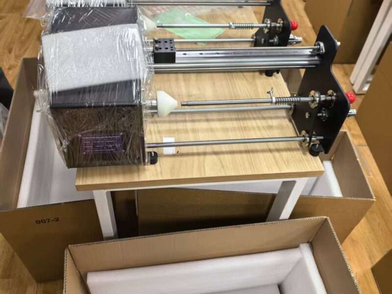 Compact fiber optic winding machines packed for shipment